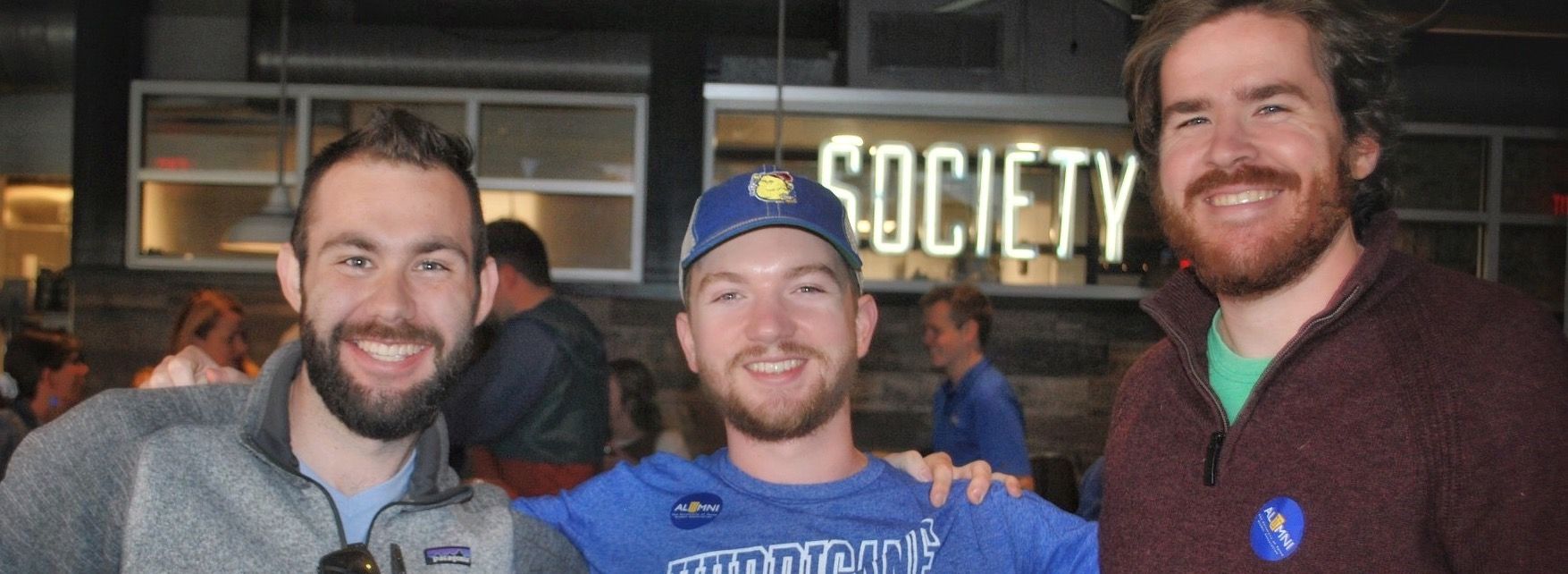 Matt, Ryan, and Pat smiling together at a TU alumni event